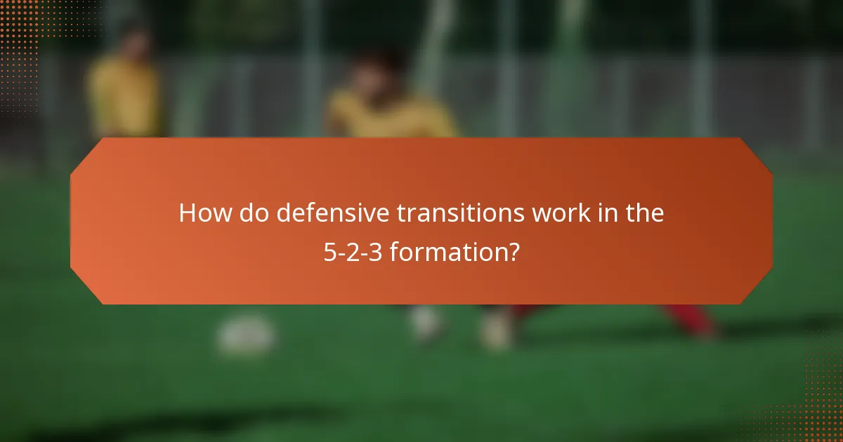 How do defensive transitions work in the 5-2-3 formation?