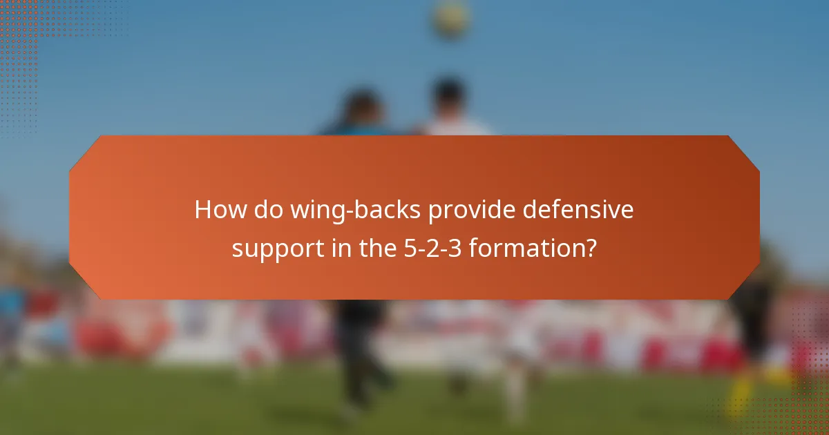 How do wing-backs provide defensive support in the 5-2-3 formation?